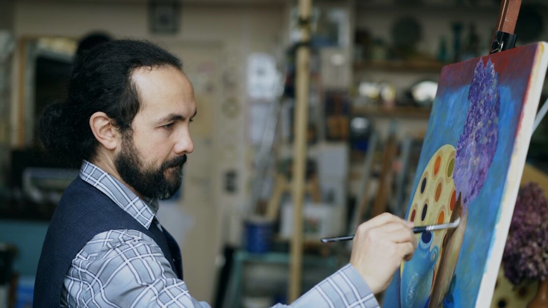 artist painting in studio